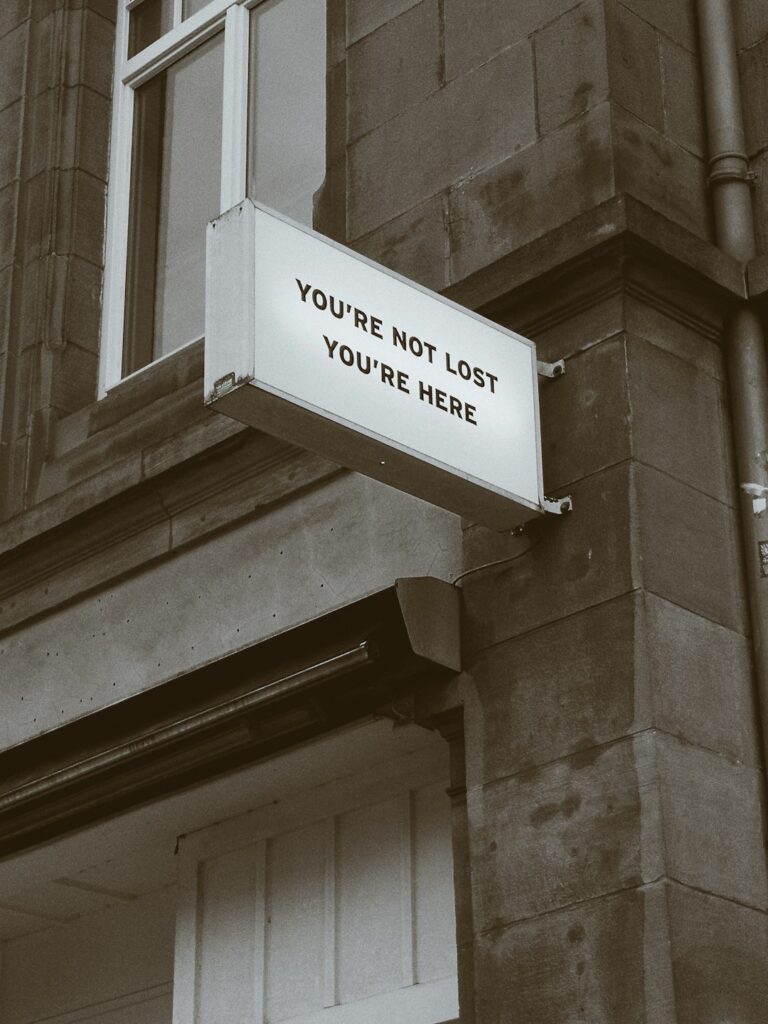 white-and-black-signage-5d5dsrq5duc You are not lost, you are here.